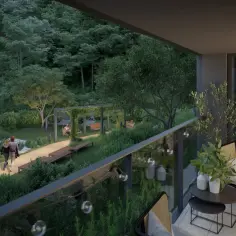 Widok z balkonu na zielony ogród. Para spaceruje ścieżką. Czy balkon wlicza się do metrażu mieszkania?