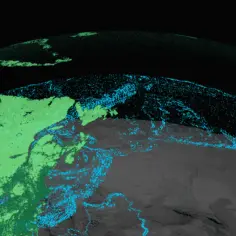 Widok Ziemi z kosmosu, gdzie zielone i niebieskie punkty oznaczają dane GIS. Analiza przestrzenna pokazuje rozmieszczenie zasobów.