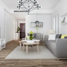Nowoczesny salon z szarą kanapą i stolikami kawowymi. Inspiracja, jak oszczędzać na mieszkanie, widoczna w funkcjonalnym designie.