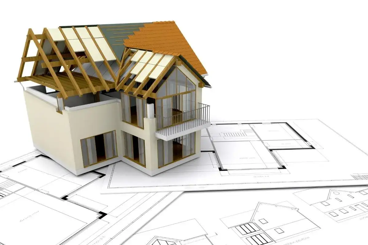 Model domu w budowie na planach architektonicznych. Jak zarobić pieniądze na budowę domu?